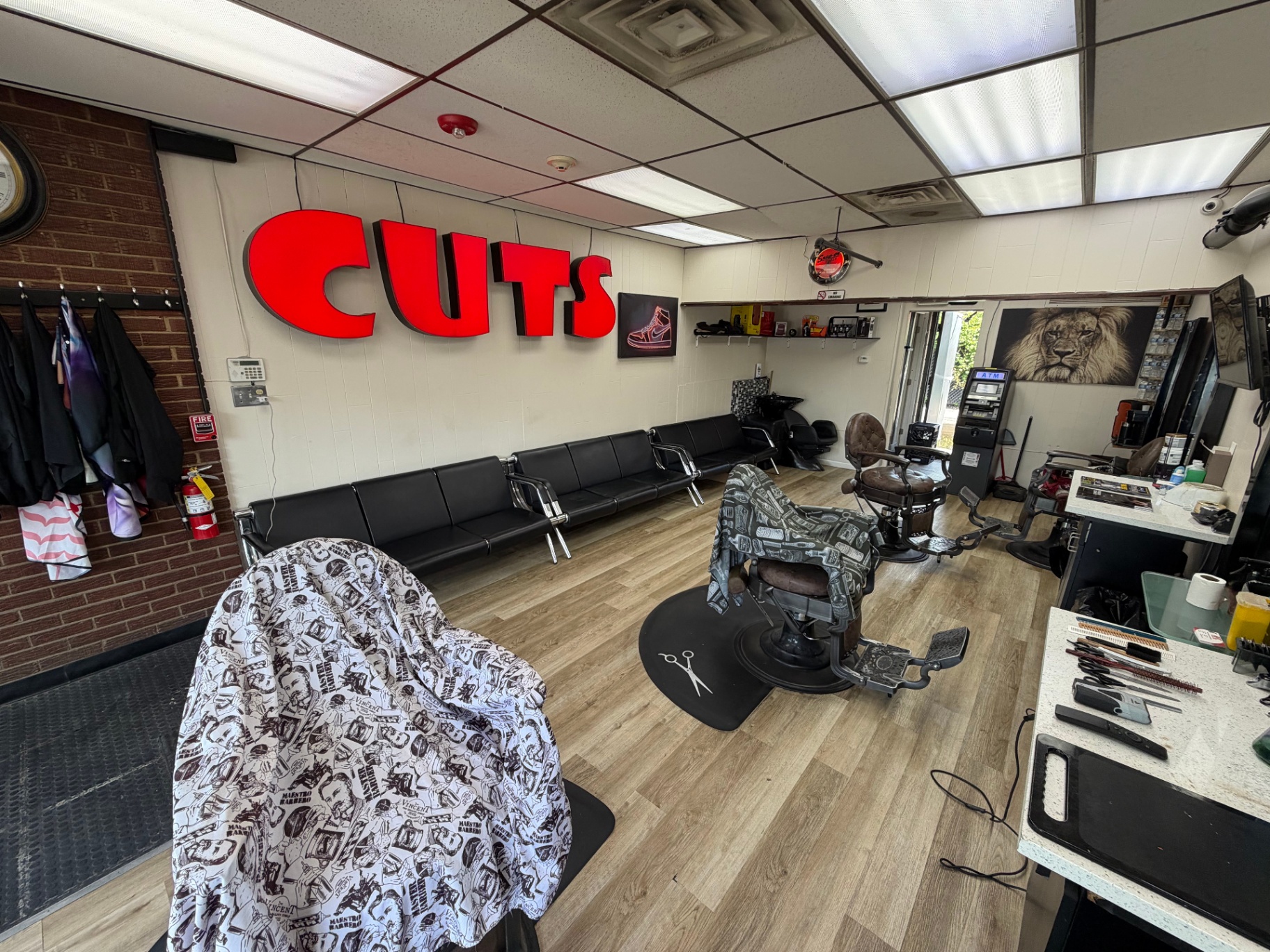 Inside SPIKEE CUTS — chairs and stations